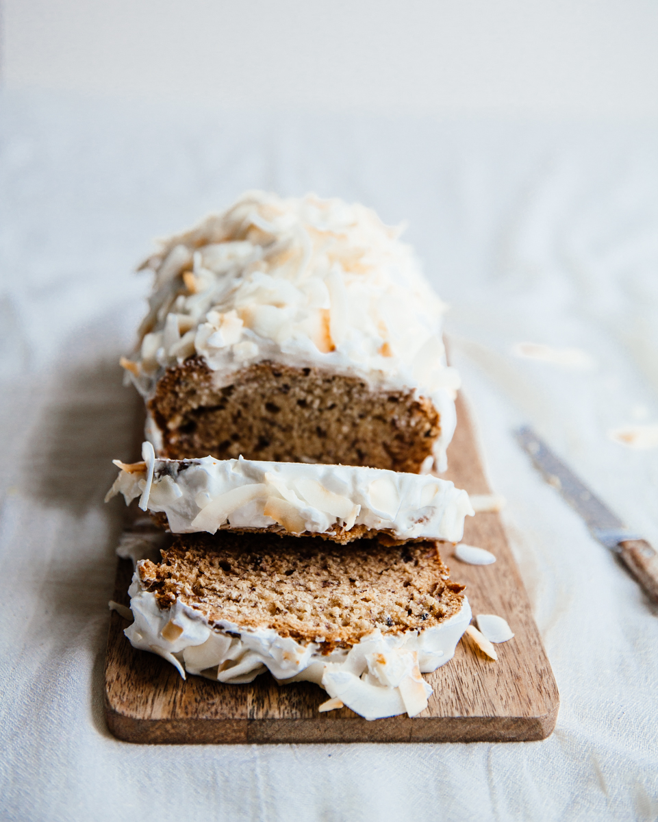 Cardamom & cocoa nib banana bread with coconut frosting