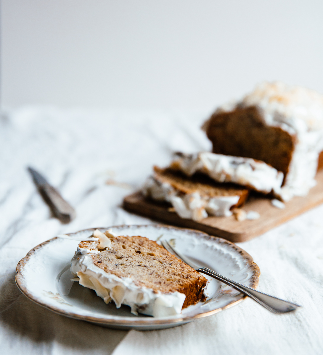 Cardamom & cocoa nib banana bread with coconut frosting