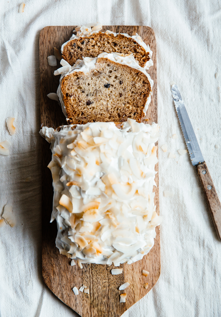 Cardamom & cocoa nib banana bread with coconut frosting