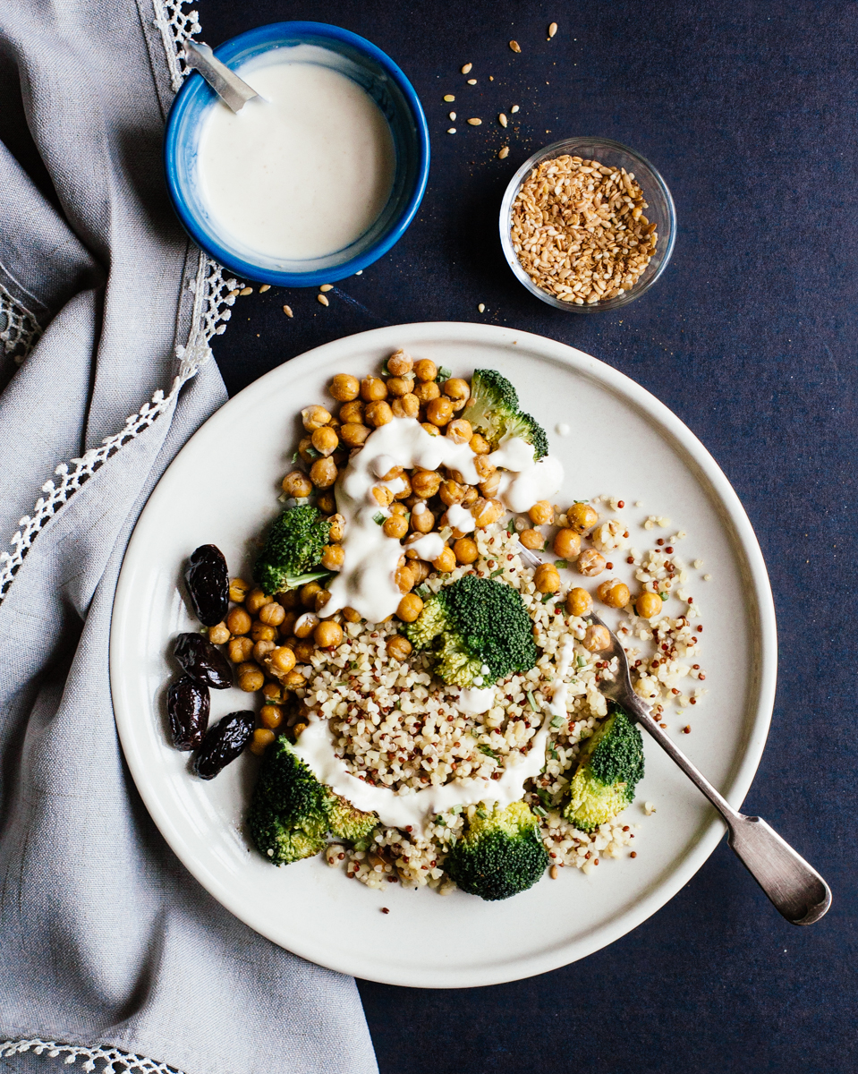 Quinoa bowl with crunchy chickpeas, roasted broccoli, olives, tahini & yogurt sauce and homemade dukkah. 