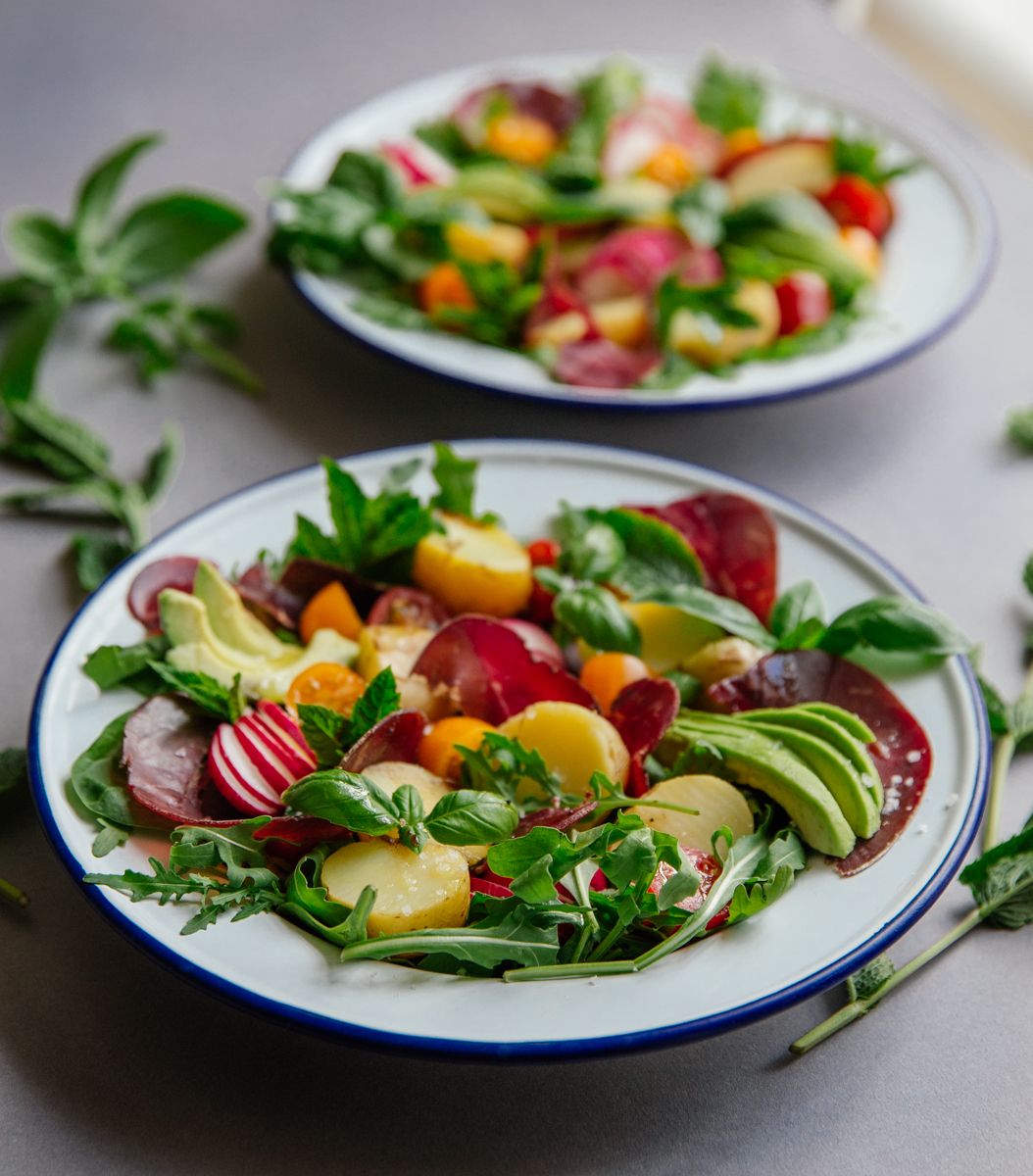 Summer potato salad with bresaola, tomatoes, radishes & avocado