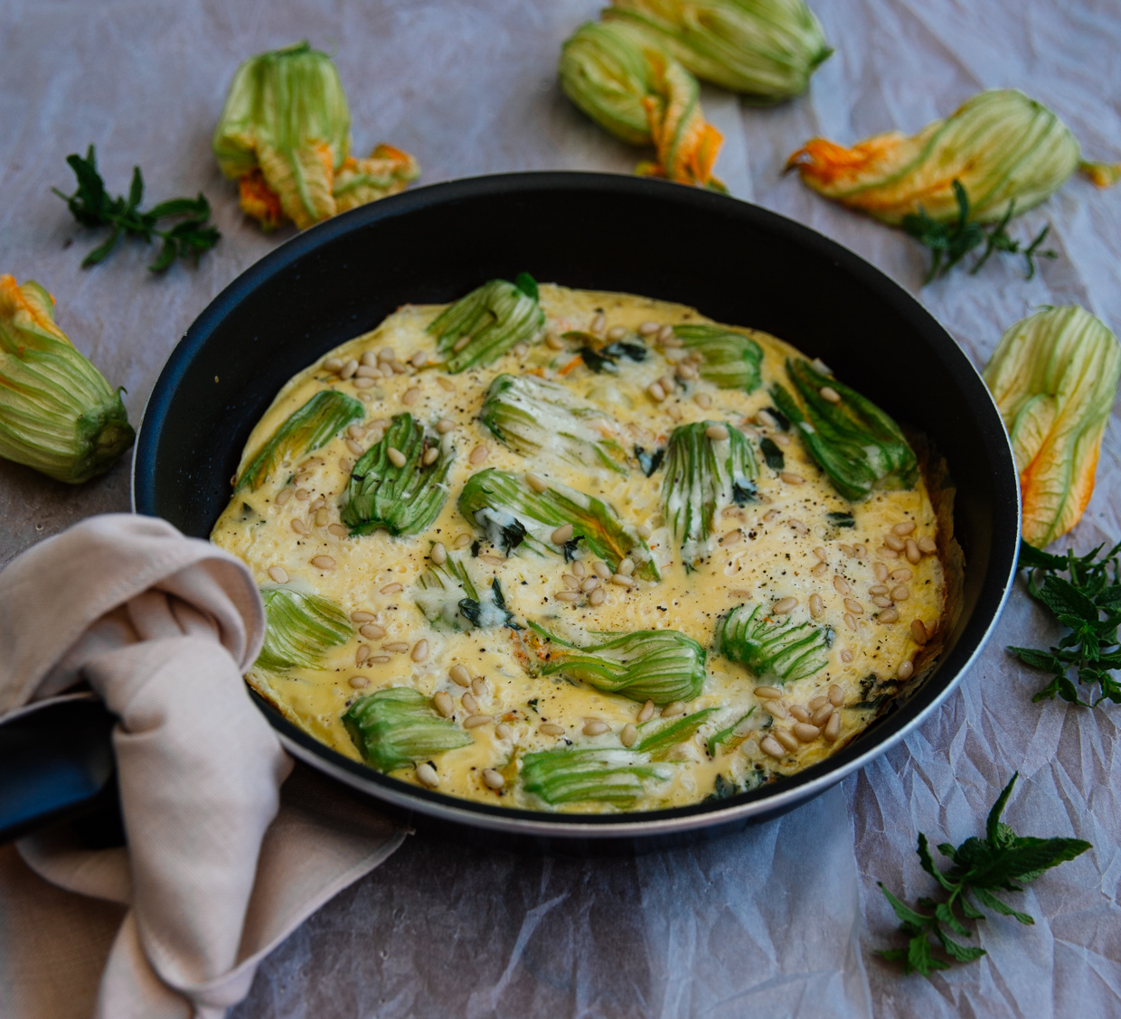 Courgette flower & pine nut omelette