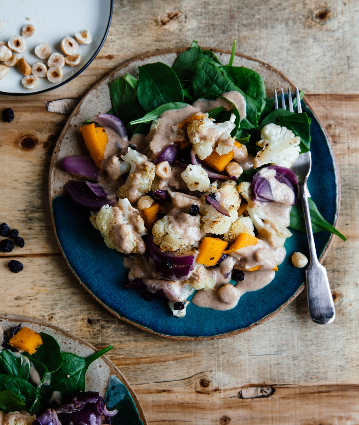 Cauliflower, spinach & hazelnut salad with peanut butter dressing