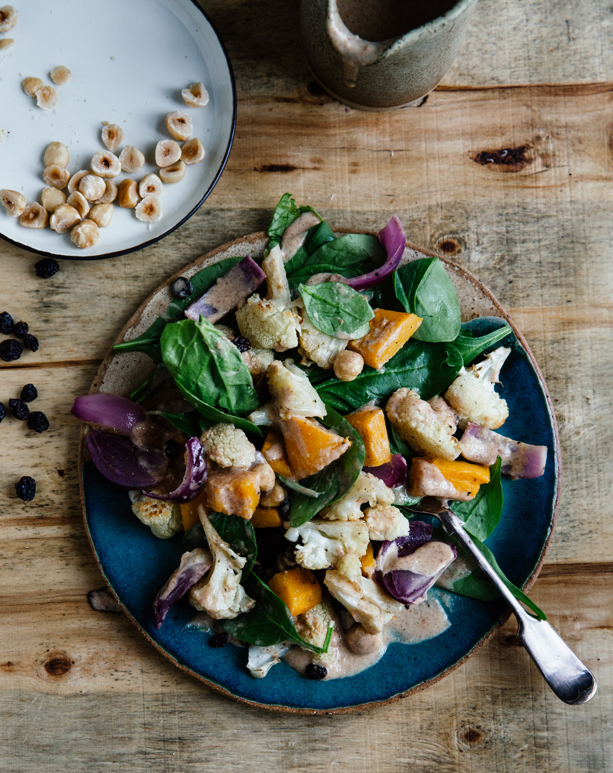 Cauliflower, spinach & hazelnut salad with peanut butter dressing