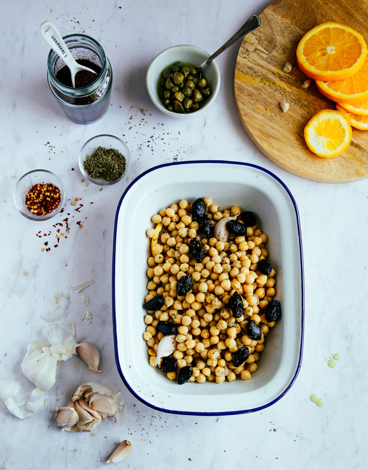 Baked chickpeas with capers, olives & orange