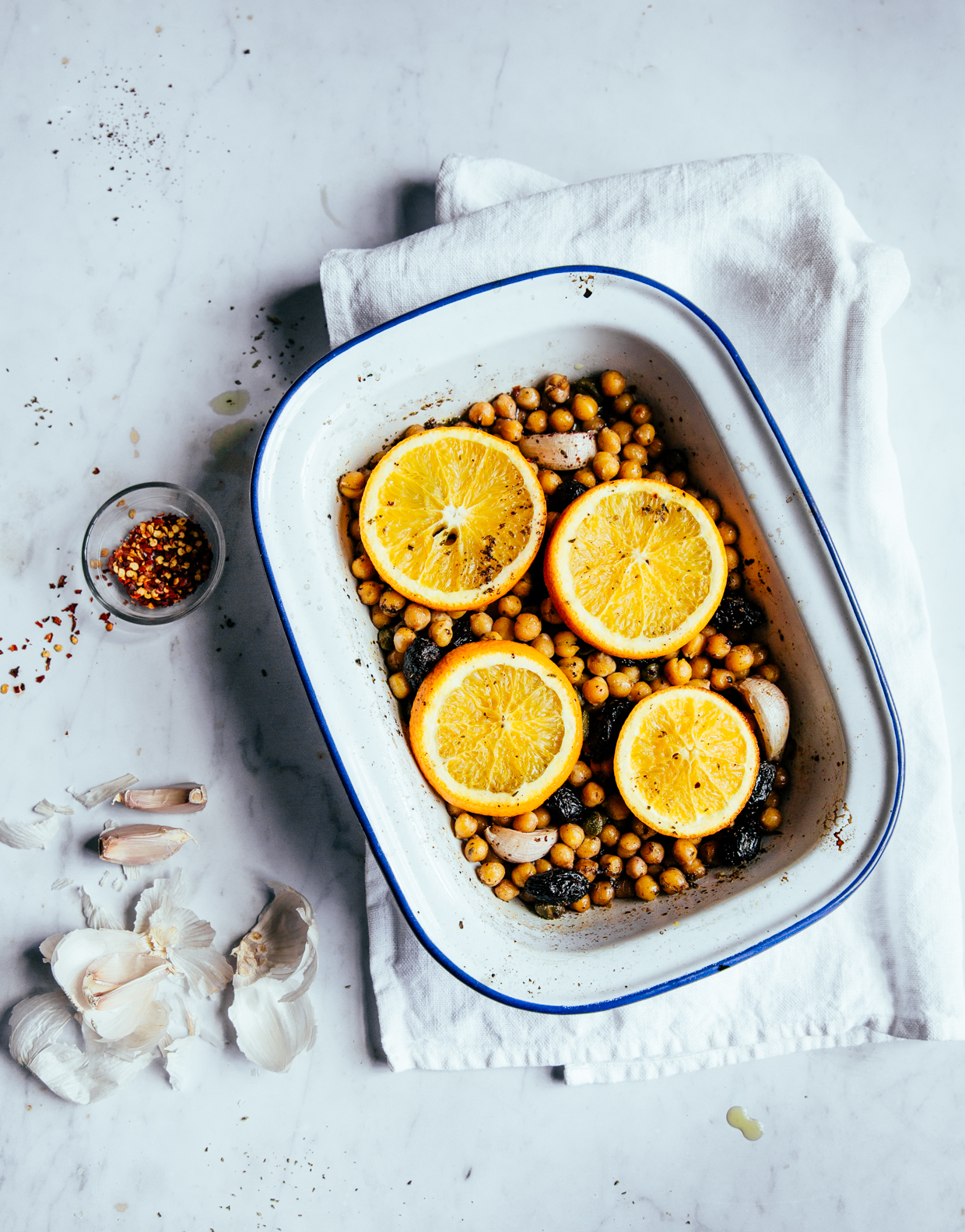 Baked chickpeas with capers, olives & orange