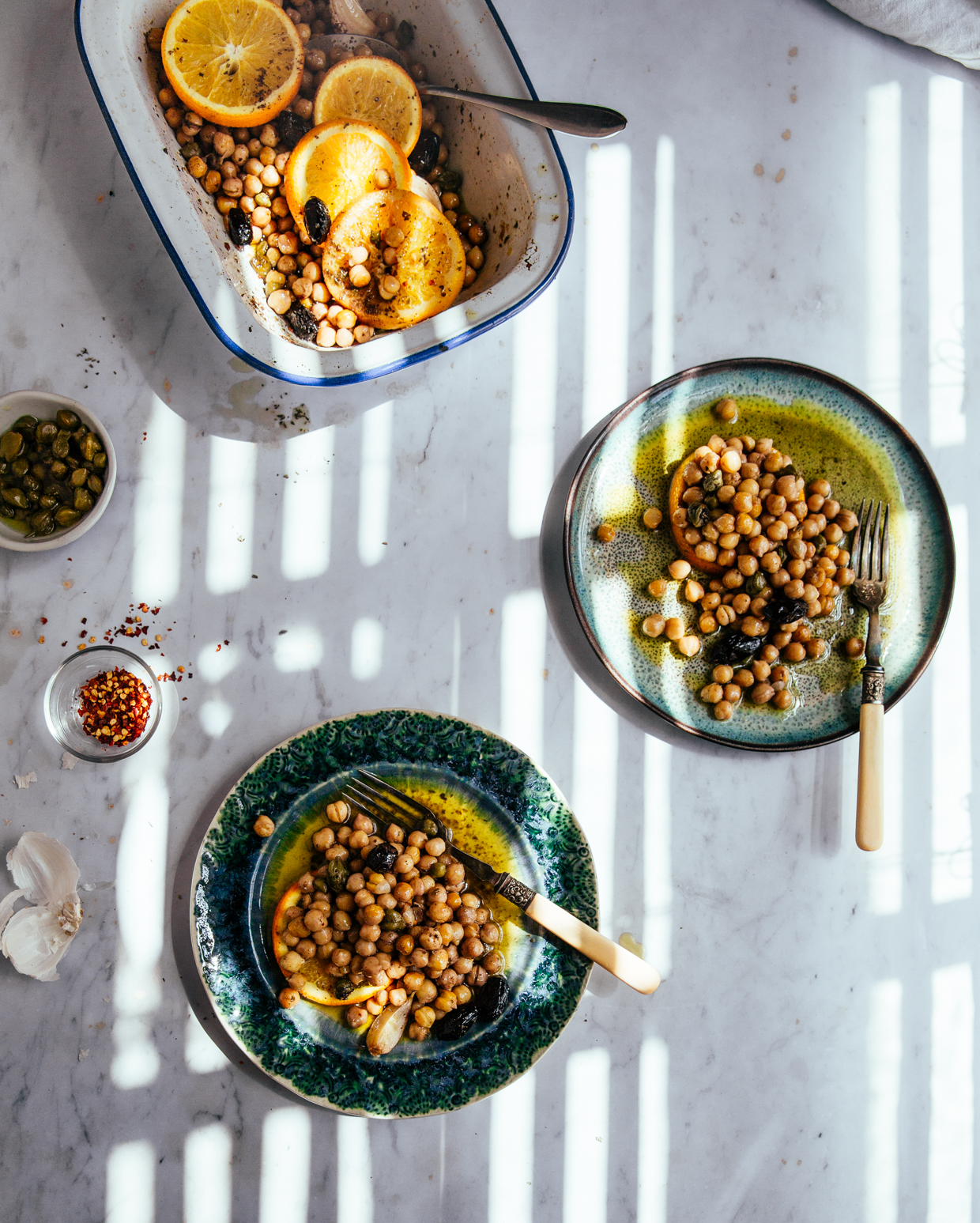 Baked chickpeas with capers, olives & orange