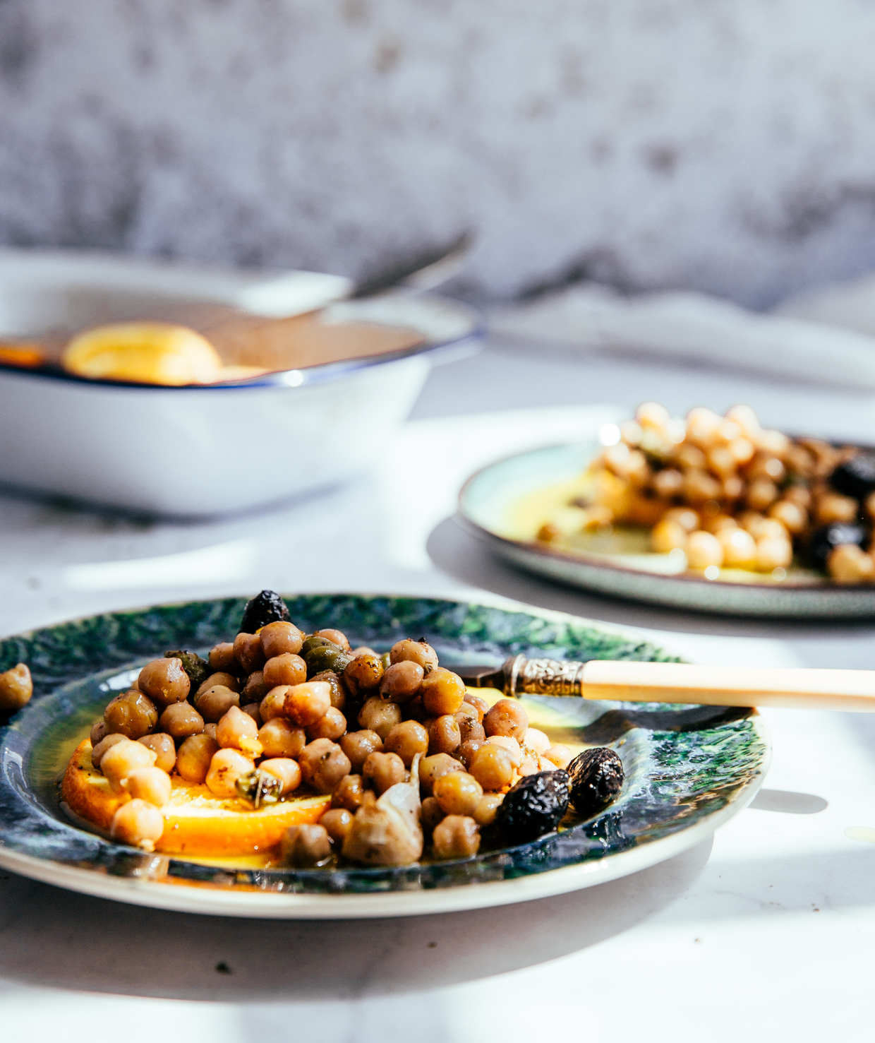 Baked chickpeas with capers, olives & orange